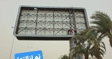 قبل سقوطهم بسبب الرياح.. إزالة 3 لوحات إعلانية واستعدال عمود إنارة بالجيزة.. صور
